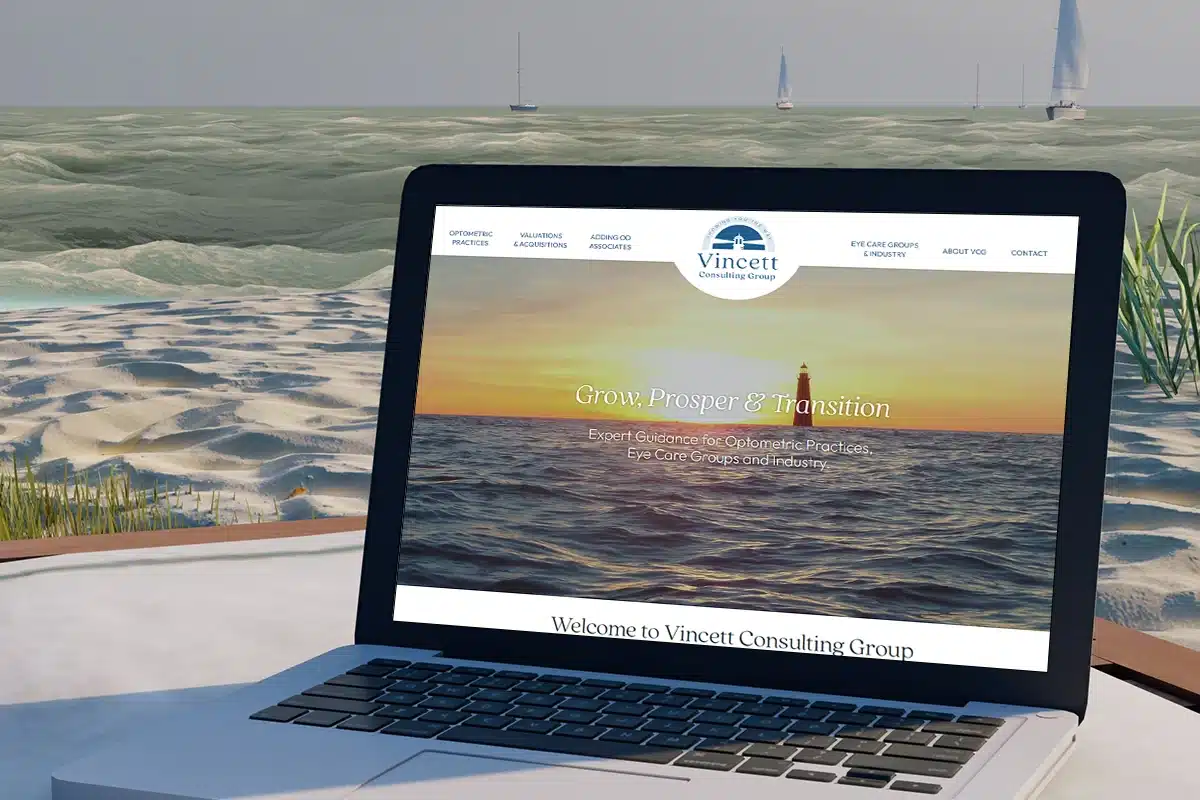 Vincett Consulting Group - website viewed on laptop at the ocean